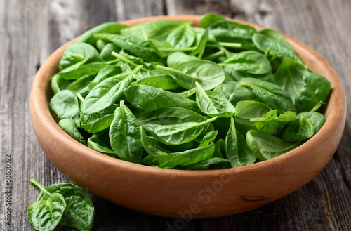 Baby spinach in a wooden plate