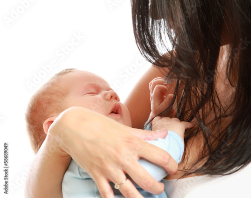 Loving mother with her infant child isolated on white background