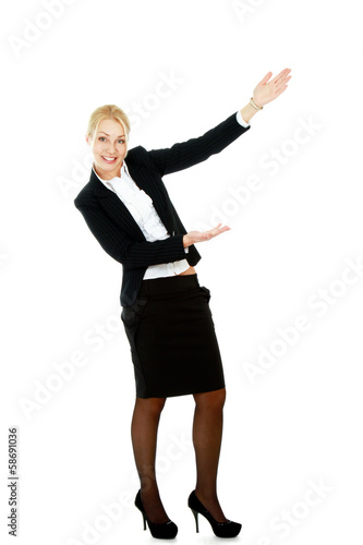 Portrait of a young beautiful businesswoman pointing something