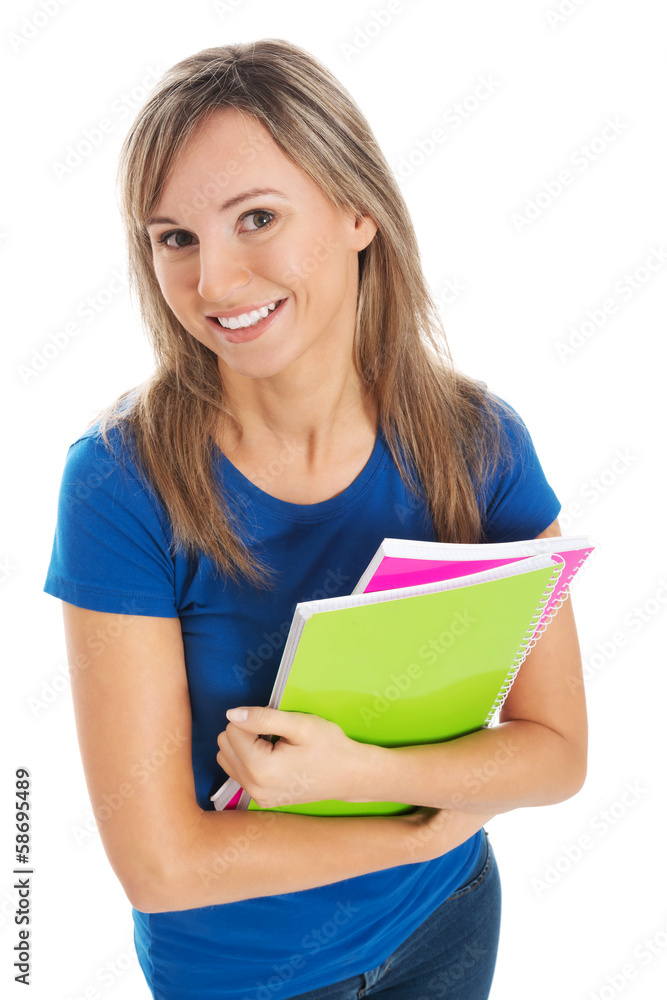Young happy and satisfied student holding workbook. Young happy and satisfied student holding workbook.