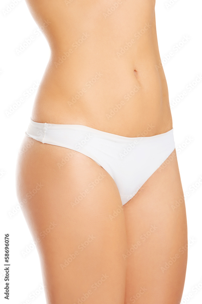 Topless woman in panties showin her flat belly. Topless woman in panties showin her flat belly.