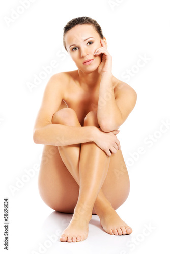Beautiful naked woman sitting.