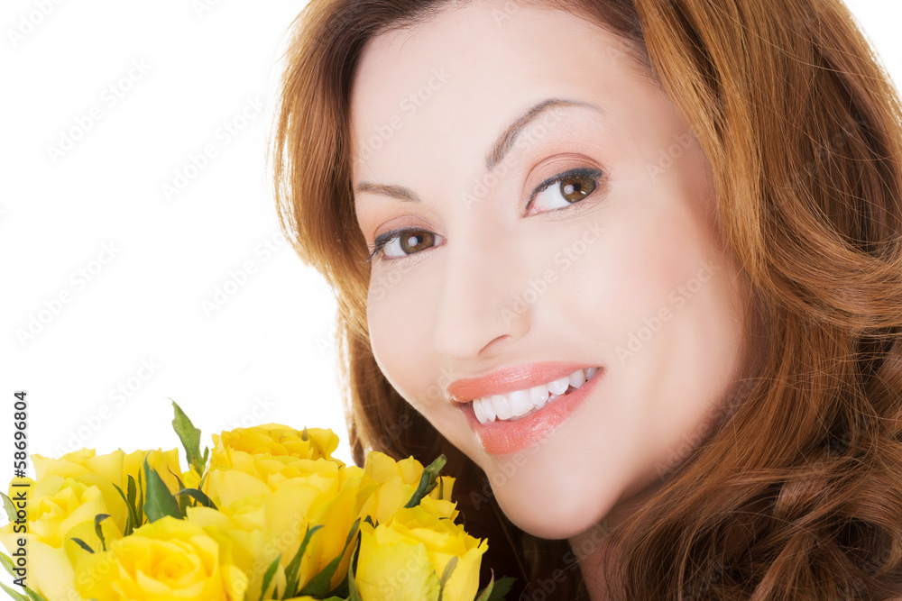 Attractive casual woman with yellow roses. Attractive casual woman with yellow roses.