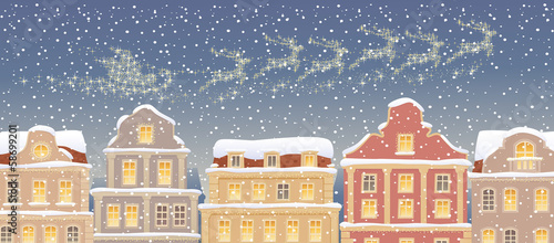 Santa Claus Sleigh flying over snow town