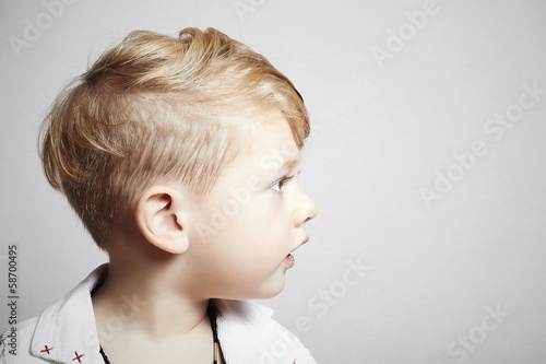 fashionable handsome little boy. stylish haircut. fashion child