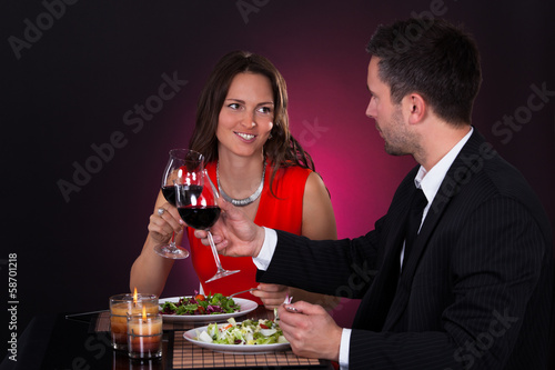 Couple Tossing Wine Glass