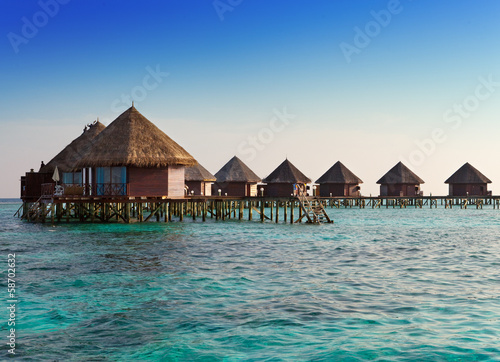 houses over the transparent quiet sea water