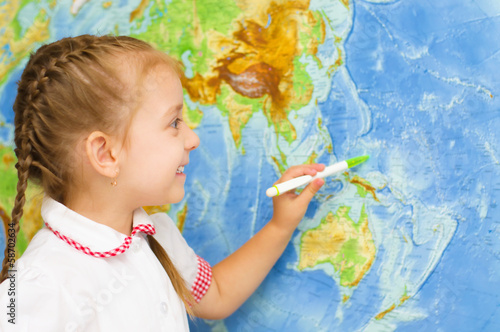 kid by world map