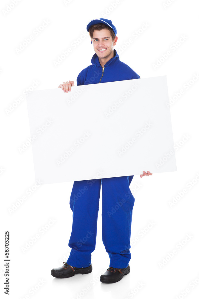 Male Worker Holding Blank Placard Male Worker Holding Blank Placard