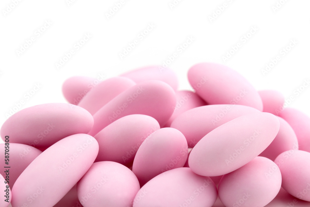 heap of pink sugared almonds heap of pink sugared almonds