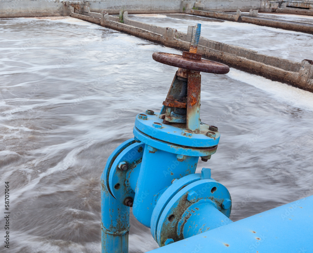 Blue valve on gas pipeline into sewage Blue valve on gas pipeline into sewage