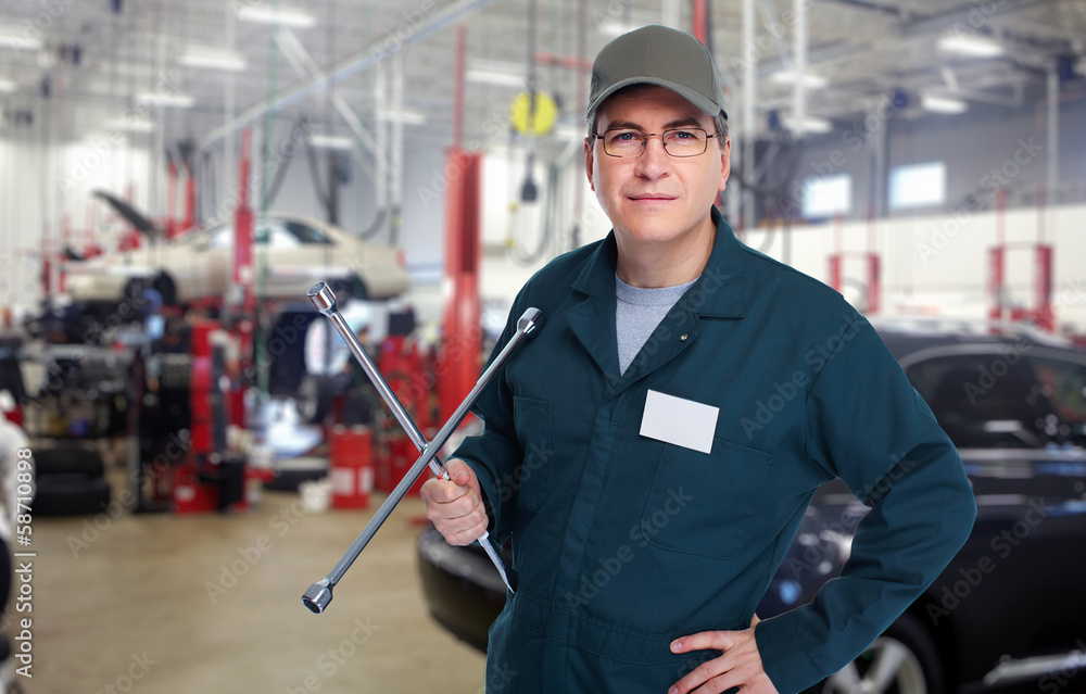 Auto mechanic with wrench. Auto mechanic with wrench.