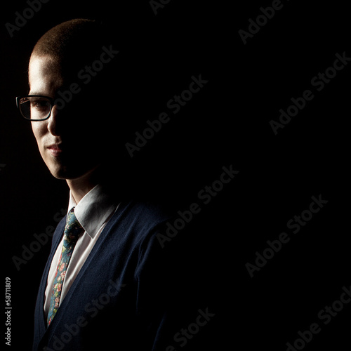 Obraz na plátně low key studio portrait of a young man