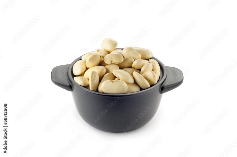 A little black ceramic dish with white cannellini beans A little black ceramic dish with white cannellini beans