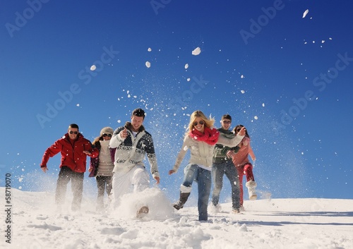friends have fun at winter on fresh snow