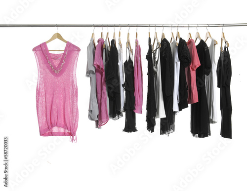 Variety of casual fashion clothing on hangers © vuvu102