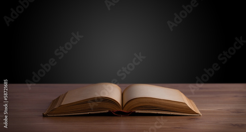 Open book on wooden deck