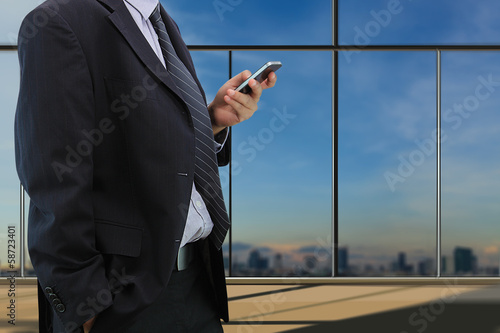 Businessman play smart phone