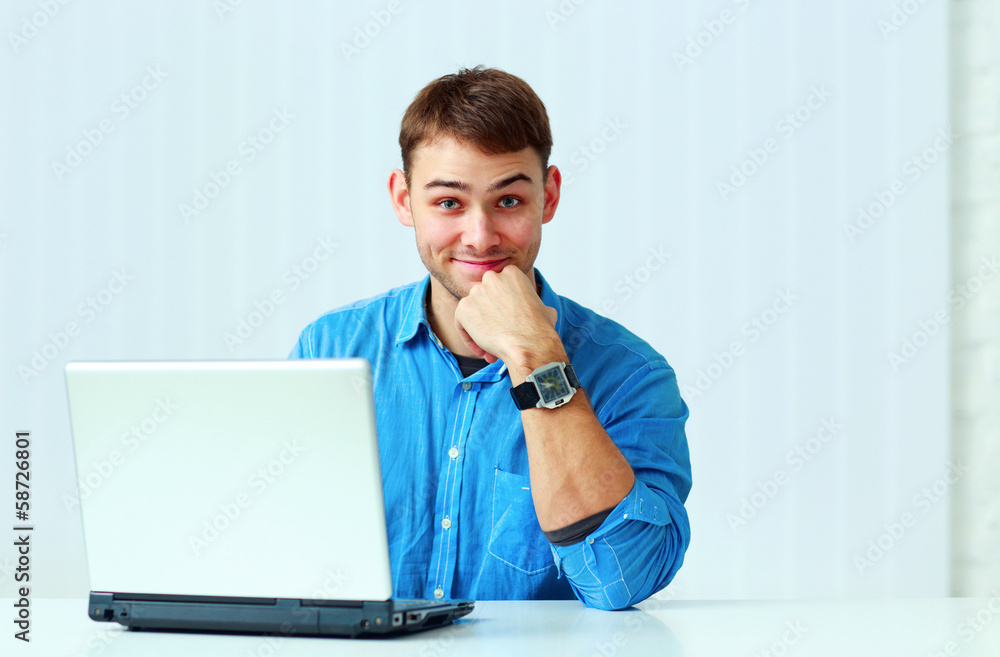 Young smiling casual businessman in blue shirt Young smiling casual businessman in blue shirt