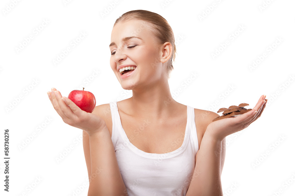 Woman holding apple and chocolate isolated Woman holding apple and chocolate isolated