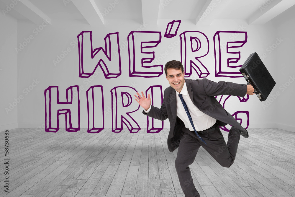 Businessman running in front of were hiring graphic Businessman running in front of were hiring graphic