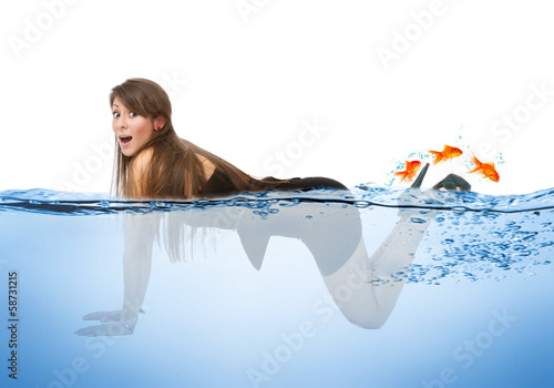 woman funny swim with red fishes photo