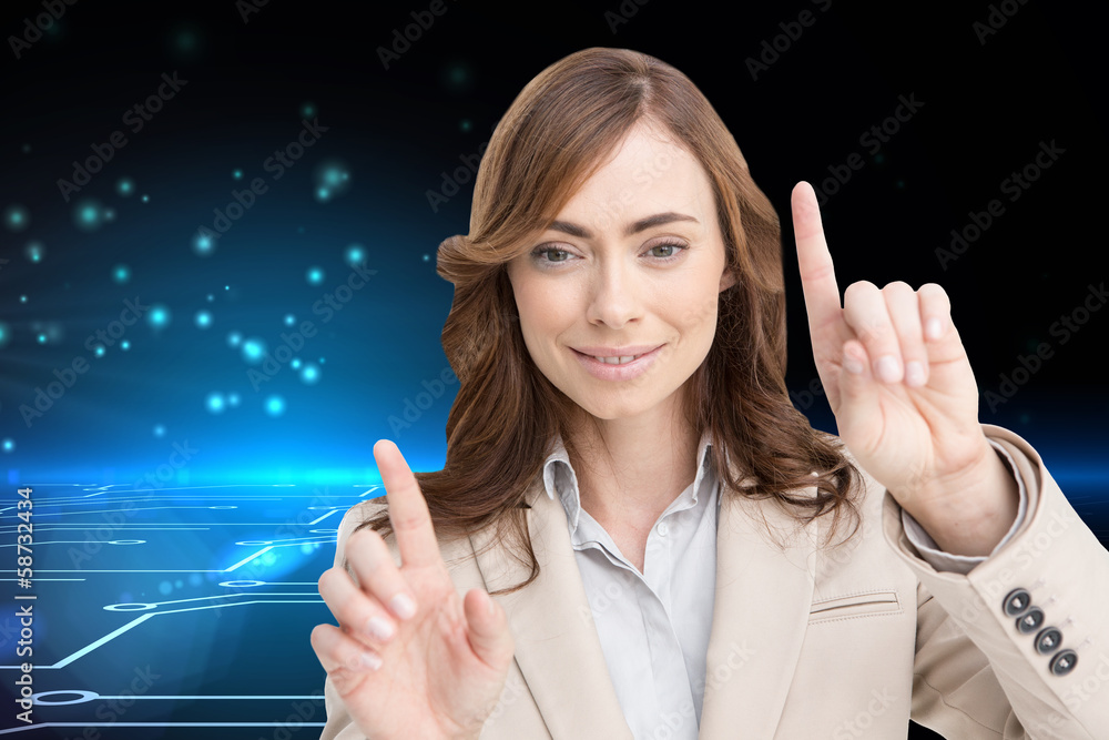 Composite image of classy businesswoman touching invisible scree Composite image of classy businesswoman touching invisible scree