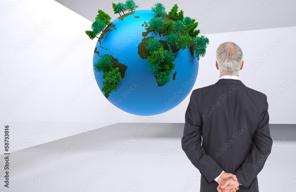 Composite image of rear view of serious businessman posing Composite image of rear view of serious businessman posing