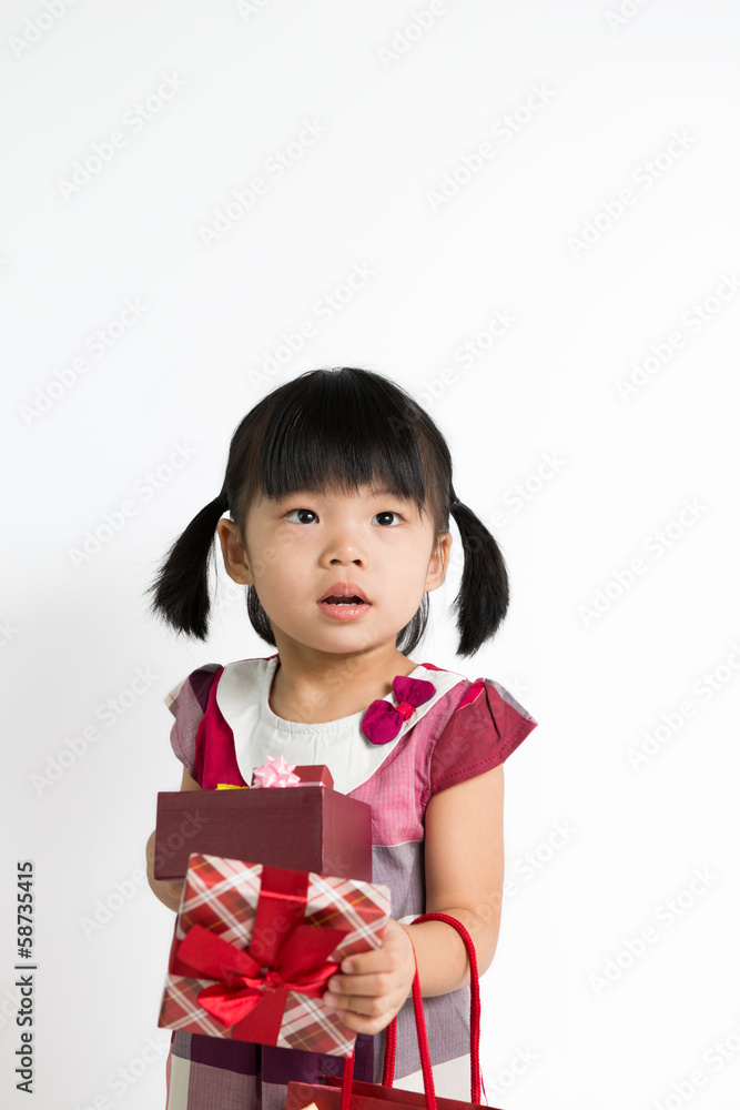 Toddler girl with gift box and bag Toddler girl with gift box and bag