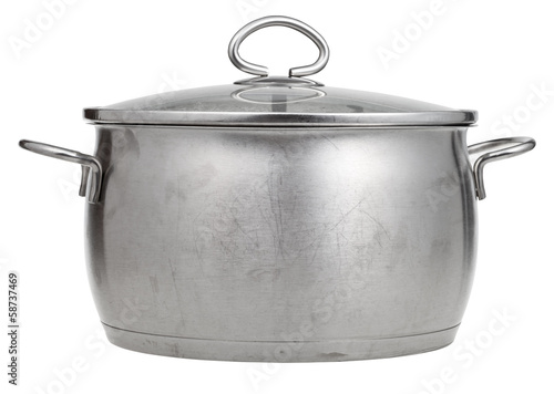 stainless steel saucepan covered by glass lid