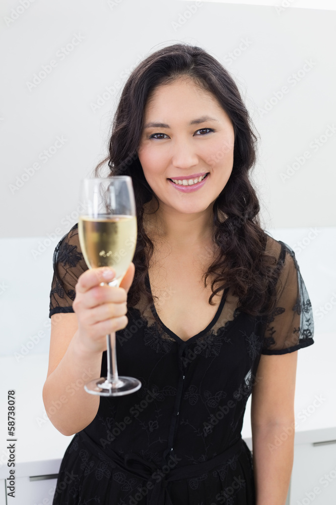 Portrait of a smiling young woman with champagne Portrait of a smiling young woman with champagne