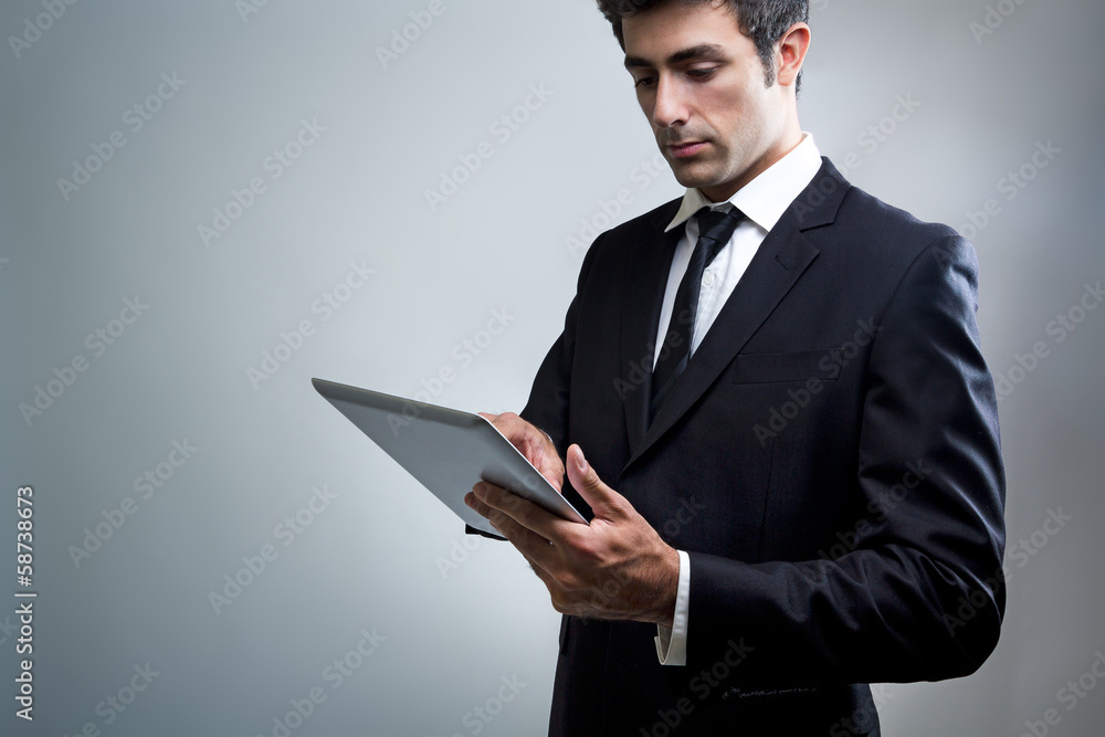 Young Businessman Using Digital Tablet Young Businessman Using Digital Tablet