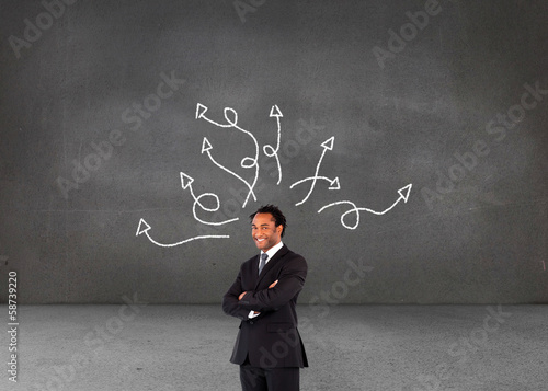 Composite image of businessman with folded arms