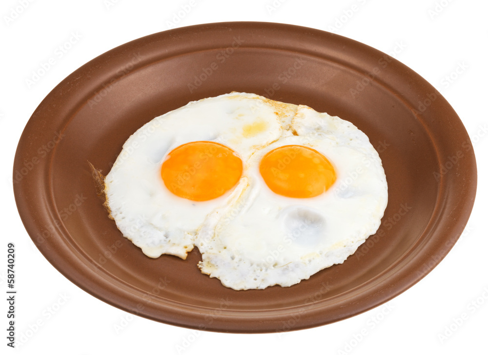 fried eggs on ceramic brown plate fried eggs on ceramic brown plate