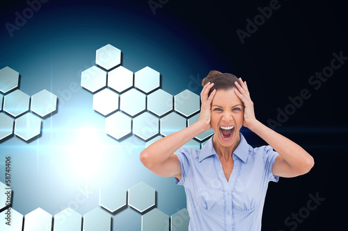 Composite image of stressed businessswoman with hand on her head photo