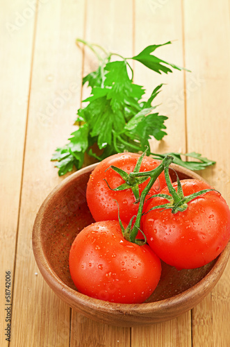 tomatoes in wooden bowlin
