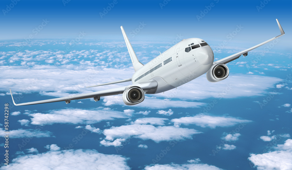 Obraz premium Passagierflugzeug über den Wolken