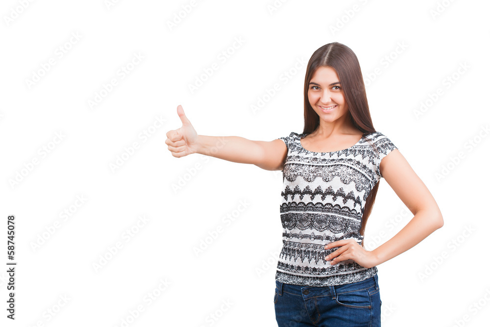 Attractive young woman shows thumb up sign Attractive young woman shows thumb up sign