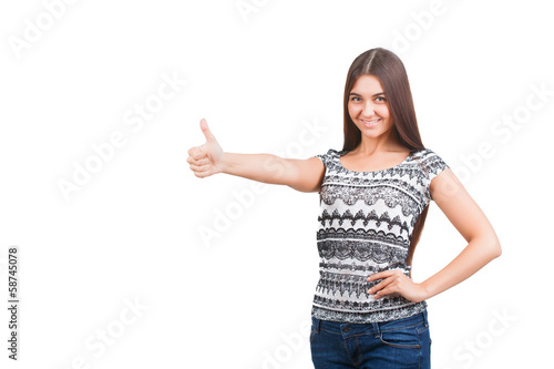 Attractive young woman shows thumb up sign
