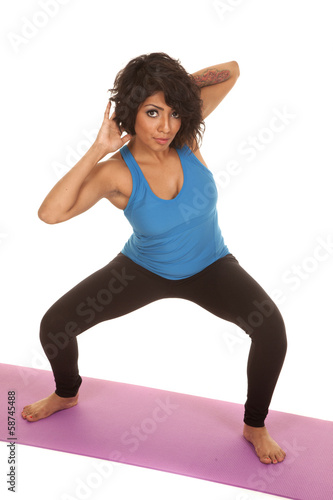 Hispanic woman fitness squat twist