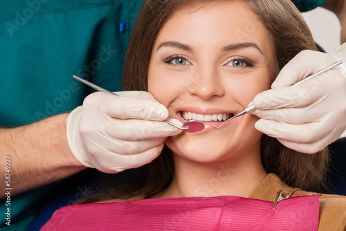 Young brunette woman at dentist s surgery