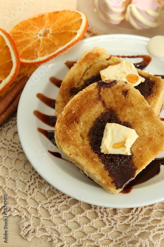 White bread toast with chocolate on wooden table