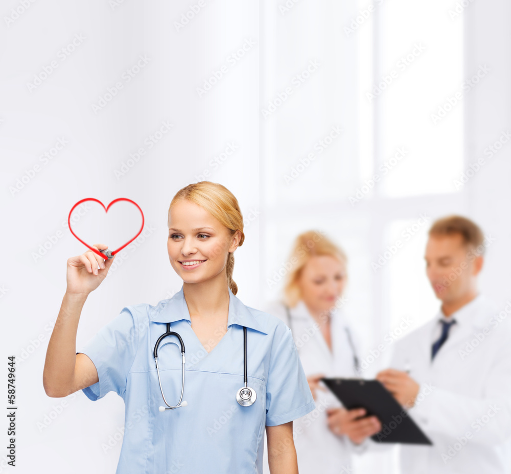 © Syda Productions - smiling doctor or nurse drawing red heart