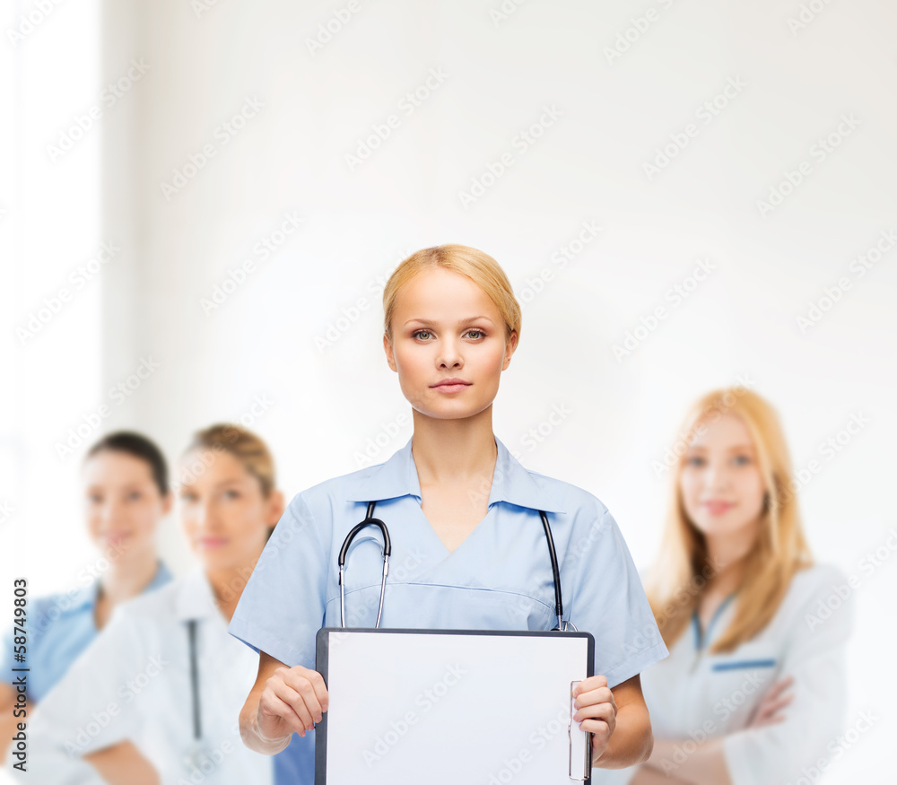smiling female doctor or nurse with sclipboard smiling female doctor or nurse with sclipboard