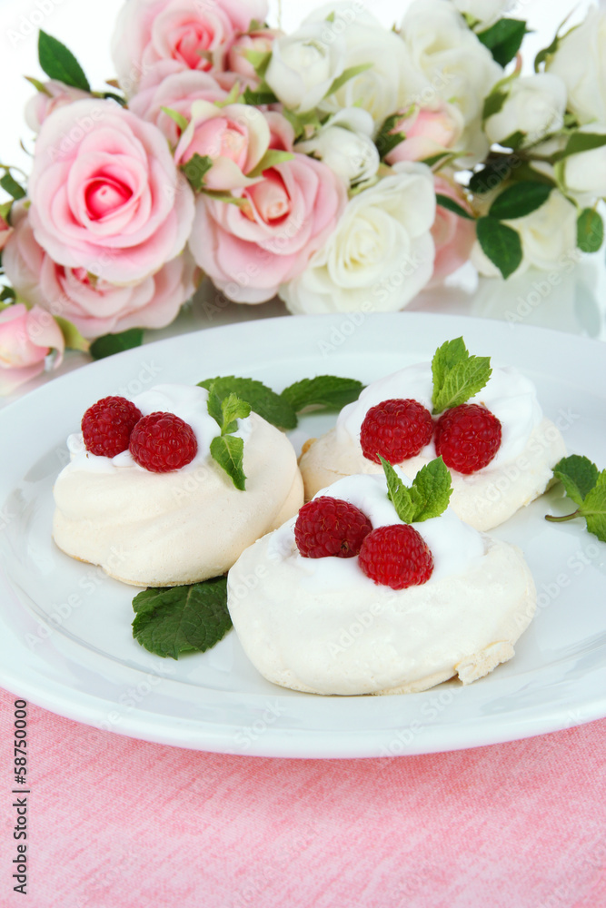 Tasty meringue cakes with berries, close up Tasty meringue cakes with berries, close up