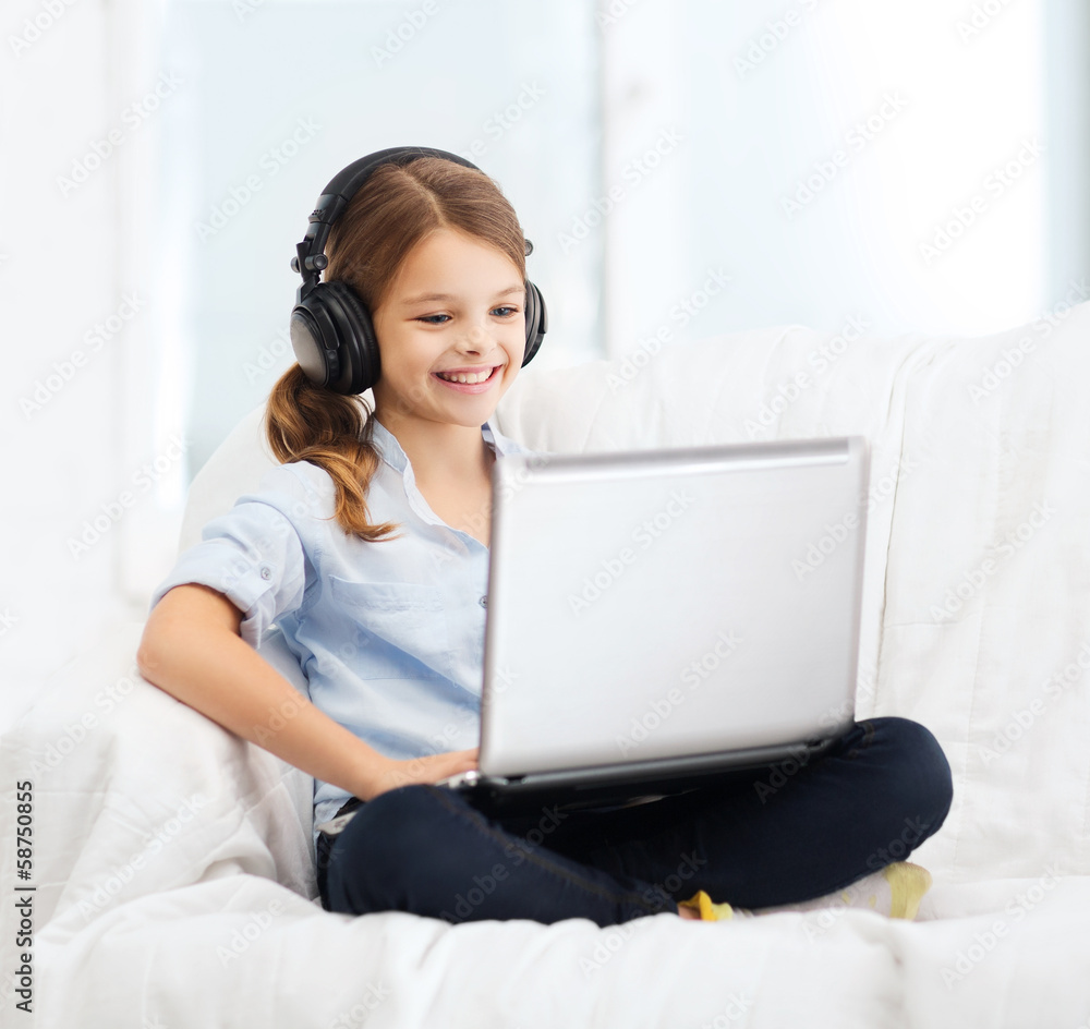 girl with laptop computer and headphones at home girl with laptop computer and headphones at home