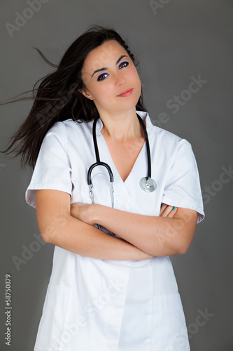  Woman doctor on grey background