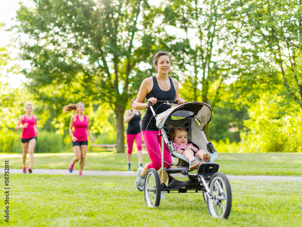 Mother running in the park Mother running in the park