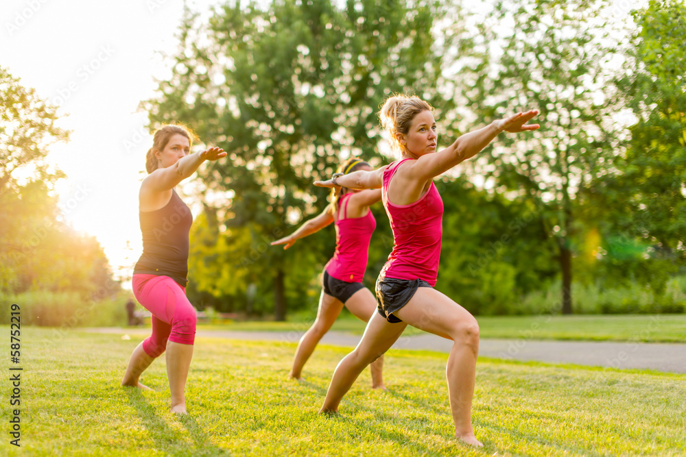 group of 3 women doing yoga in nature group of 3 women doing yoga in nature