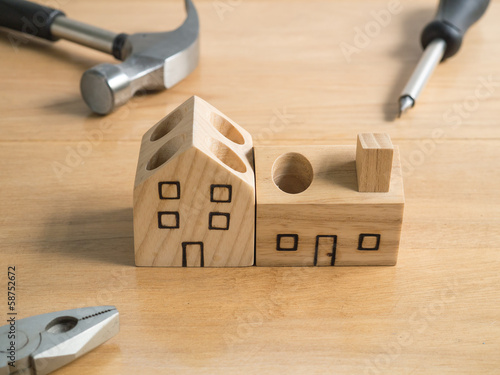 Set of tools and wood house toy. photo